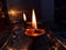 Worshipping hindu religion but oil lamps with selective focus