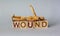 wound healing, word with cubes written in English