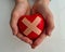 Wounded heart with plaster in children hands