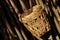 Woven bamboo basket, wood twig background