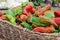 Woven basket filled with colorful red and green peppers