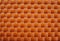 Woven fabric close-up. The material is orange.