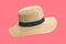 Woven fedora hat on pink background