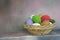 Woven rattan basket of colored eggs