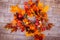 Woven wreath decorated orange leaves, autumn vegetables