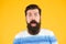 Wow. Real surprise. Man bearded stylish beard yellow background. Barber tips. Beard and mustache. Hipster style. Beard