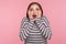 Wow, unbelievable! Portrait of excited surprised woman in striped sweatshirt standing with open mouth and touching face