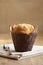 Wrapped almond muffin in rustic style