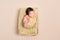 Wrapped black-haired baby basket, topview