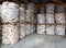 Wrapped bundles of pre-cut firewood on pallets or skids ready for sale and shipping