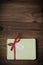 Wrapped Gift Package with Merry Christmas Label on Wood Planking