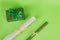 Wrapped gift wrapping paper. green paper in a roll. Gift in green packaging. White paper in a roll.