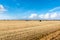 Wrapped Hay Bales in a Filed and Blue Sky