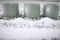 Wrapped hay bales in snow