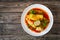 Wrapped minced meat in cabbage leaves - polish dish golabki on wooden table