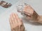 Wrapping finger nails with foil during the procedure of manicure at a spa salon