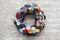 Wreath decorated by cloth buttons on grey backgrounds