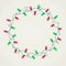 Wreath of green and red Christmas lights on white