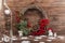 Wreath with lotus flower and red berries. Christmas winter frame on dark wooden background. Red elements