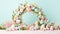 A wreath made of eggs and flowers on a pink surface, AI