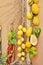 A wreath of normal lemons and lemons with a thick skin, bergamot, peppers and lemons suspended on a pipe