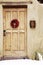 Wreath Red Chile Ristra Hanging on Wooden Door, Santa Fe, New Me