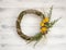 Wreath from a vine with roses. Handmade decor. Wreath of real twigs