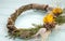 Wreath from a vine with roses. Handmade decor. Wreath of real twigs