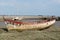 Wreck of fishing boat in the cemetery of boats at low tide