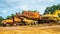 Wreck of heavy machinery in the junkyard of forestry company.