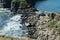 The wreckage of a boat crashed on the stones