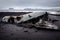 Wreckage of crashed plane on sandy shore of iceland beach