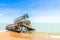 The wreckage of the fishing boat is beached  with blue sea and the blue sky as background.location Satheep Thailand