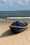 Wreckage wooden boat with fishing net on  a beach side