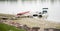 Wrecked Dock & Damaged Boat on Water After Storm