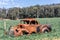 Wrecked, rusted car in an Australian field near Marysville