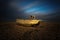 Wrecked ship in sunset at Dungeness beach, England, UK