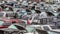 Wrecking yard filled with broken vehicles, car, trucks, and suv`s