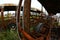 The wrecks of the buses standing on the vehicle cemetery.