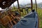 The wrecks of the buses standing on the vehicle cemetery.