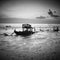 A wrecks old boat at beach.