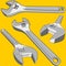 Wrench silver various perspective yellow background