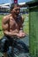 A wrestler cools off under the water fountains after competing in hot conditions at the Kirkpinar Turkish Oil Wrestling Festival