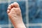 Wrinkled bare feet coming out from a bathtub. Young person getting a bath feet close-up indoor in bathroom interrior photo