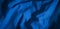 Wrinkled blue fabric texture background