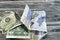 Wrinkled and crumpled Saudi Arabia money of 20 SAR twenty riyals and 1 one American dollar cash money, Money inflation and losing