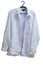 Wrinkled male white laundered shirt on hanger