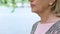 Wrinkled old woman close up, thyroid gland illness, medical examination, health