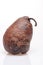 Wrinkled and rotten brown pear isolated