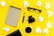 Writer office desk with notebook, ink, pen and glasses yellow background top view space for text